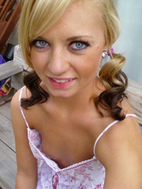 Pretty blonde Tiny Tiff shows her teensy tits & flashes a naked upskirt