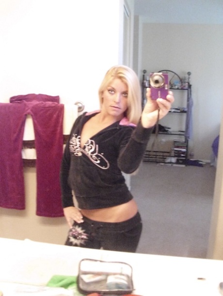 Blonde amateur Lena Scotte takes selfies of her small tits and bald slit
