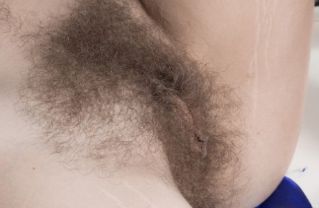 Amateur model Pixxy spreads her legs in bathroom to exhibit her hairy vagina