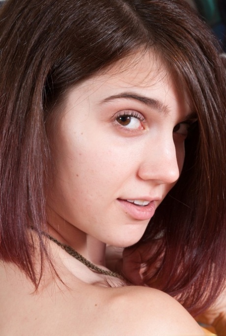 Young amateur Aislynn spreading naked to reveal an extremely hairy beaver