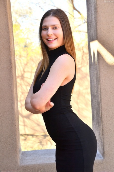 Leggy beauty Kamryn doffs a black dress before toying her beautiful pussy