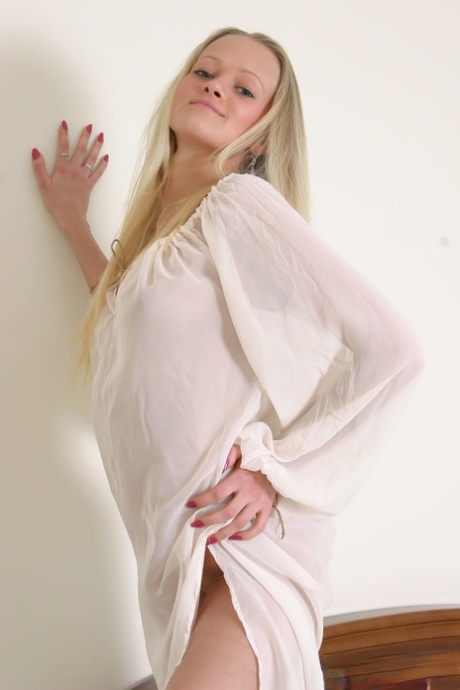 18-year-old blonde Marta A shows her tight ass and slit during solo action
