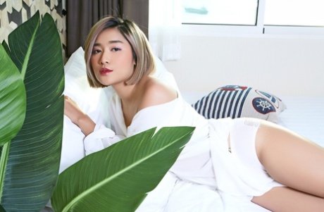 Asian beauty Apple sports red lips while spreading her natural pussy