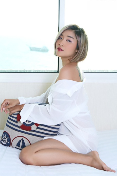 Asian beauty Apple sports red lips while spreading her natural pussy