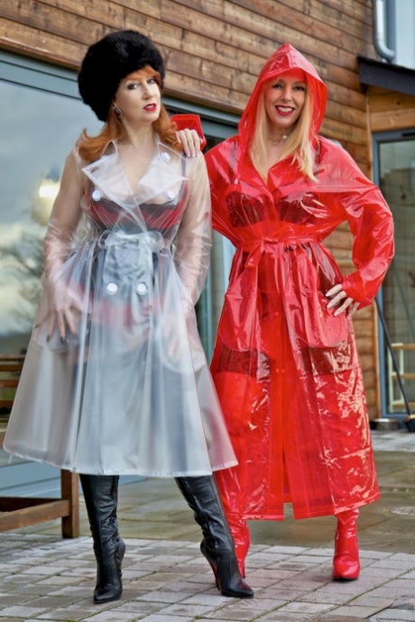 British lesbians expose boobs while modelling raincoats and thigh-high boots
