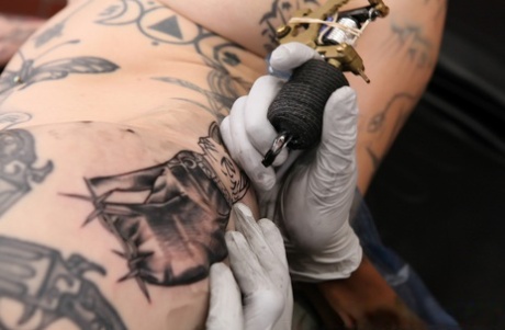 Tattooed girl Sascha Ink gets fresh ink before sex with a tattooed man