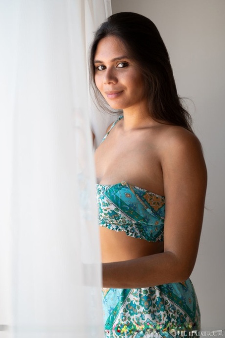 Beautiful Latina teen Savana gets totally naked during a solo engagement