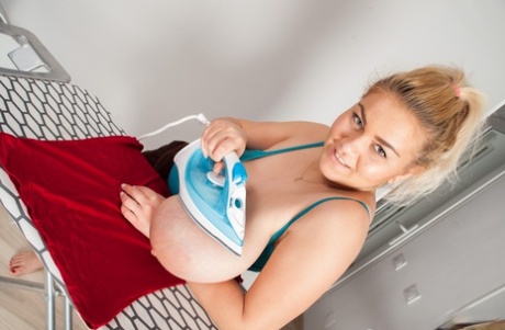 Big titted blonde plumper Erin Star gets naked while doing her ironing