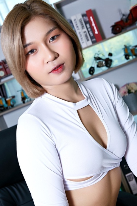 Hot Asian secretary Nyla dildos her bush at work in high-heeled shoes