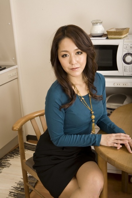 Japanese lady Nao Kato strips to her birthday suit on a kitchen table