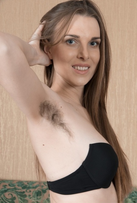 Amateur solo girl Donatella proudly displays her unshaven armpits and vagina