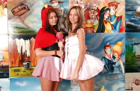Seductive teen lesbians with sexy legs having fun with their toys