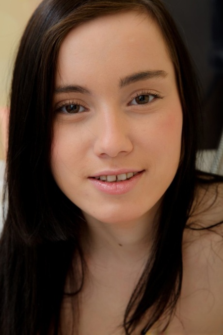 Natural teen Delphina masturbates with a big toy while taking a bath