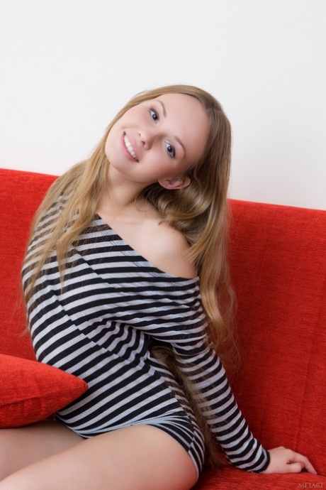 Russian teen Virginia Sun uncovers her small tits and ass in a solo