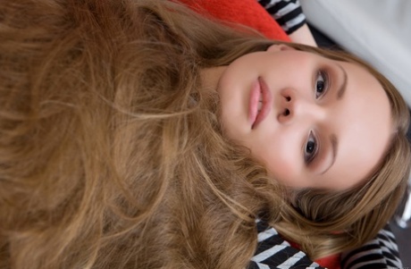 Russian teen Virginia Sun uncovers her small tits and ass in a solo