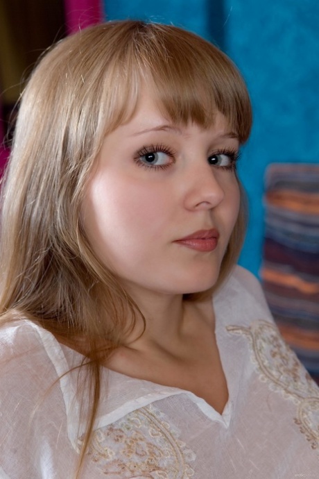 Gorgeous teen Wendy B posing and showing her furry pussy in a solo