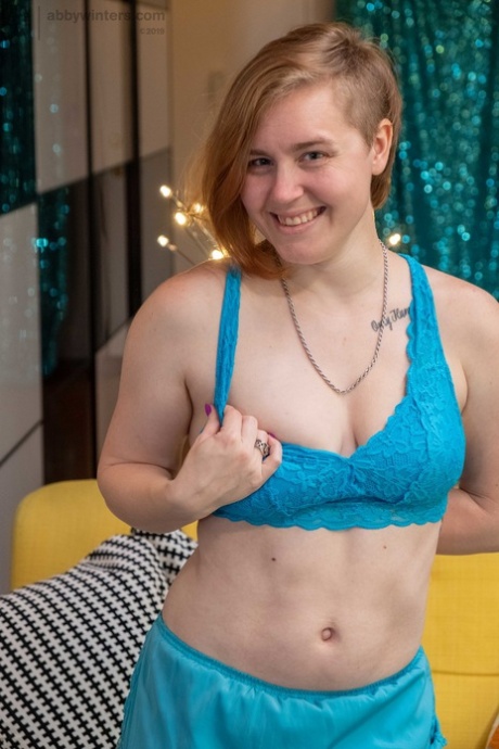 Half bald amateur Annika reveals her hairy and pierced cunt in a solo