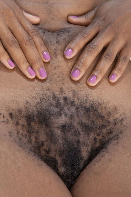 Ebony with dreads Carla Cain shows her big ass and hairy pussy in a solo