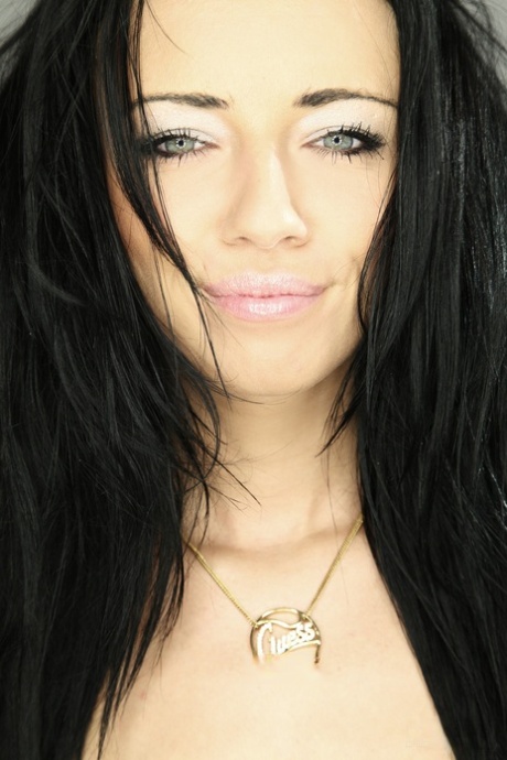 European babe Gina Devine doffs her clothes and plays with her twat lips
