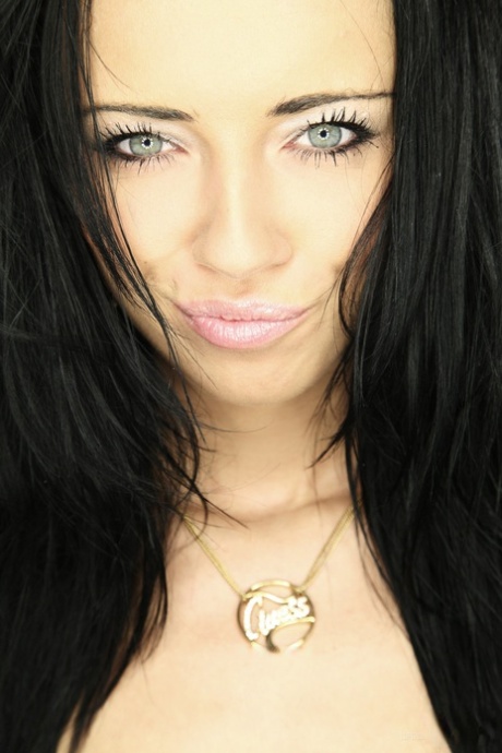 European babe Gina Devine doffs her clothes and plays with her twat lips