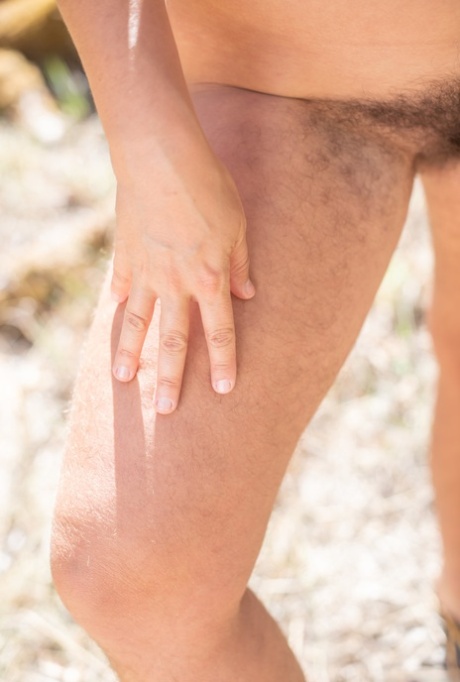 Thick amateur brunette Nikki Silver shows her hairy legs, armpits and pussy