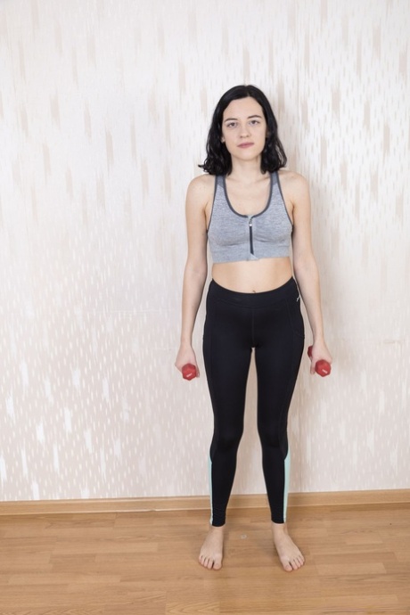 American newbie Calina spreads her hairy muff while lifting weights butt naked