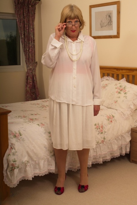 Slutty granny Rosemary toying her hungry old pussy in a red corset