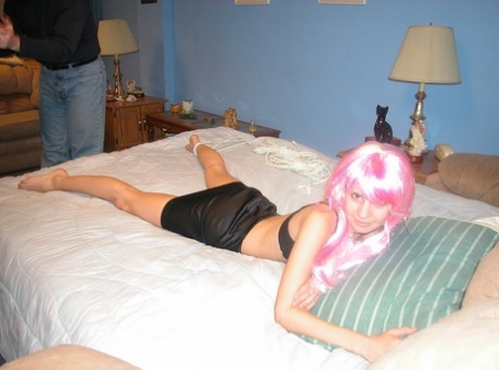 Pantyless pink-haired Latina Roxanne gets bound, stripped and ass slapped