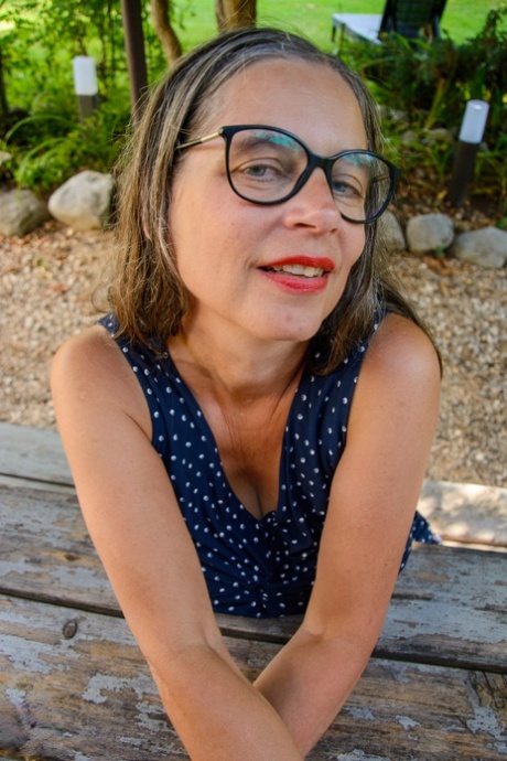 Dirty GILF in glasses Busty Tina lets out her amazing big tits & ass outdoors