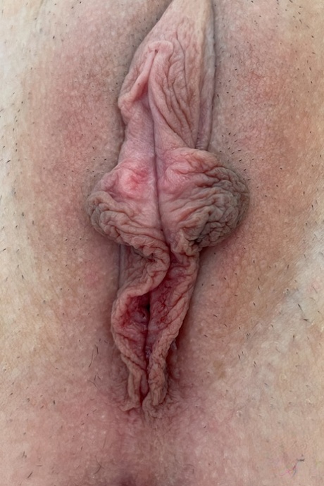 Pretty blonde babe Cecelia Taylor shows her large labia up close