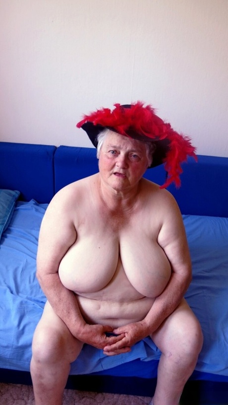 Playful granny Jagoda strips down naked and shows off her big saggy tits