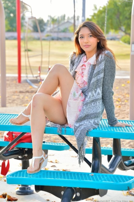 Sweet teen Melody flaunts her tasty cunt and round ass in the park
