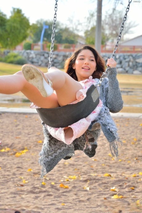 Sweet teen Melody flaunts her tasty cunt and round ass in the park