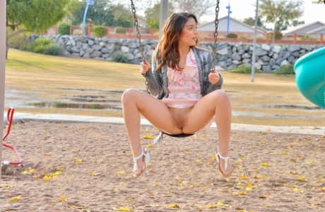 Sweet teen Melody flaunts her tasty cunt and round ass in the park